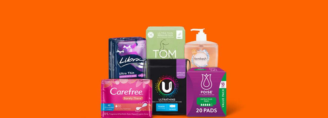 A variety of feminine hygiene products, including pads, liners, and feminine wash.