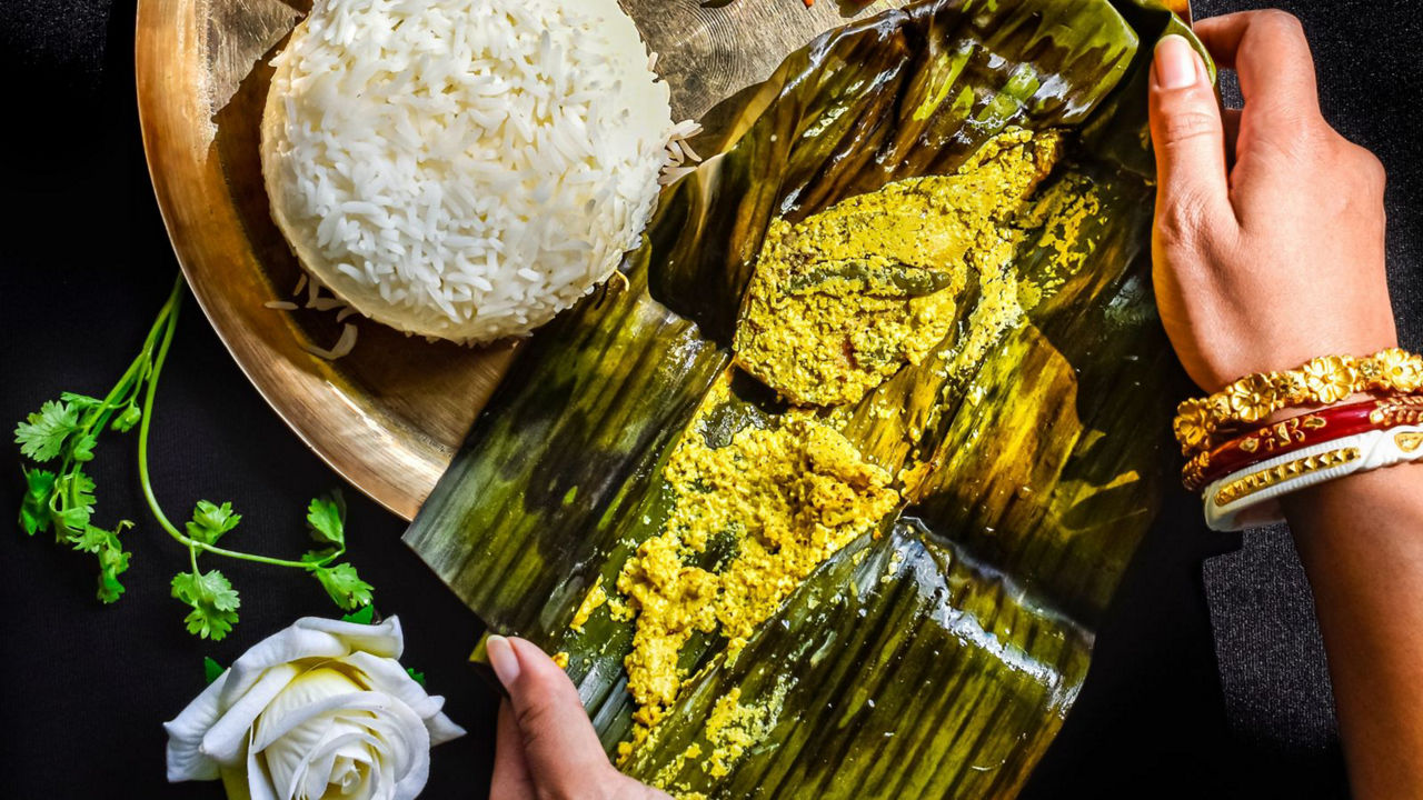 Traditional meal with banana leaf wrap