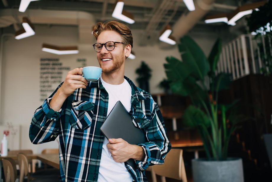 Intern holding coffee mug