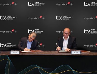(L-R) Amit Kapur, Country Head - UK & Ireland, TCS; Shai Weiss, CEO - Virgin Atlantic Signing the Partnership Document