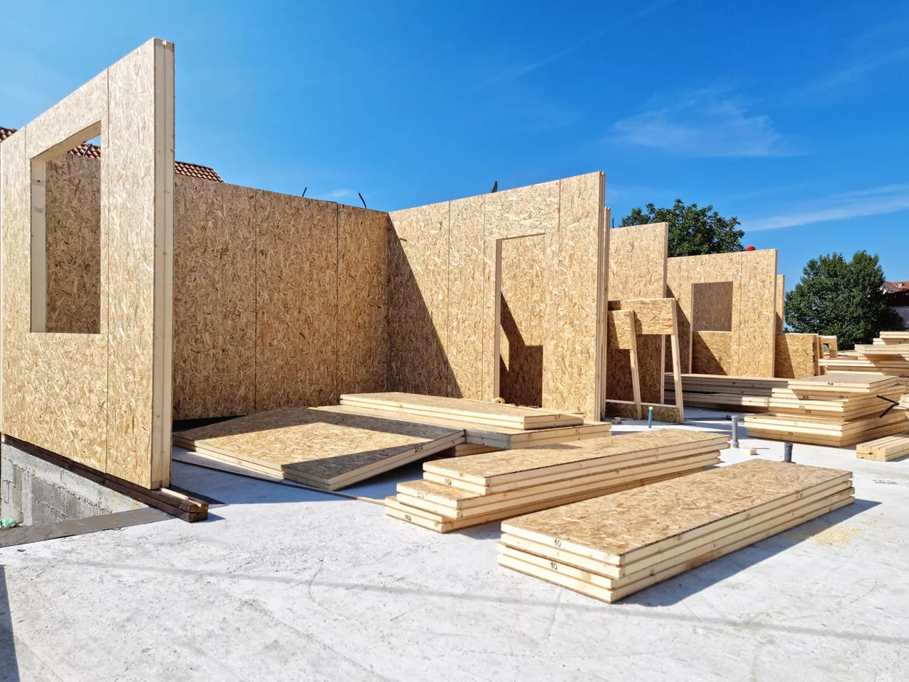 Construction of new and modern prefabricated modular house from composite wood panels. Energy efficient panel assembling