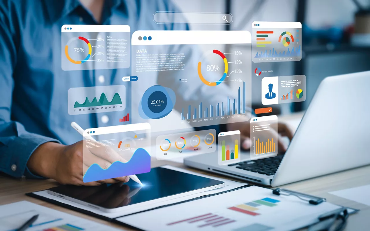 An analyst uses a computer and dashboard for data business analysis and Data Management System with KPI and metrics connected to the database for technology finance, operations, sales, marketing 