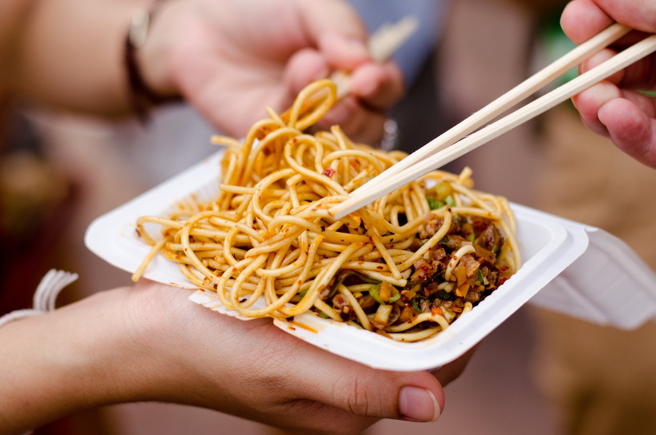 Closeup of fried noodles in takeout container