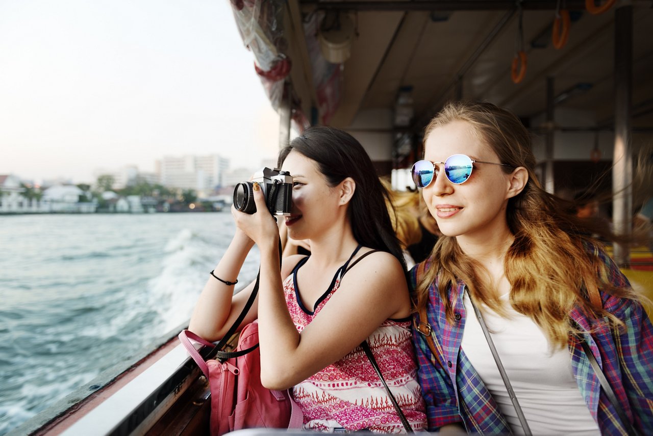 Two women go on a sightseeing ferry tou