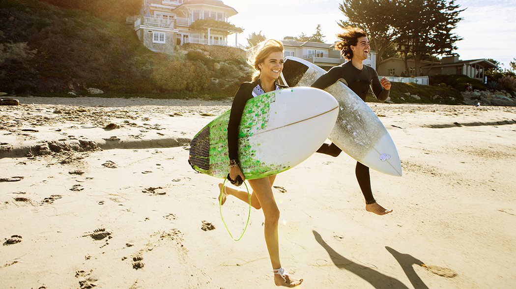 girls with surf board in hands