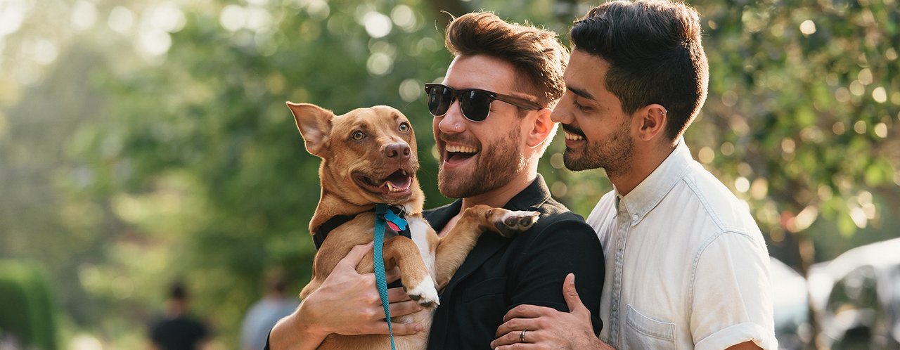 2 guys with a dog