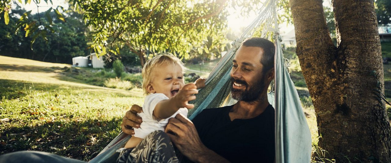 Dad with son in hammock
