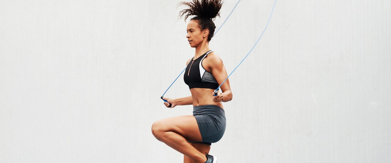 a girl doing exercise on a skipping rope