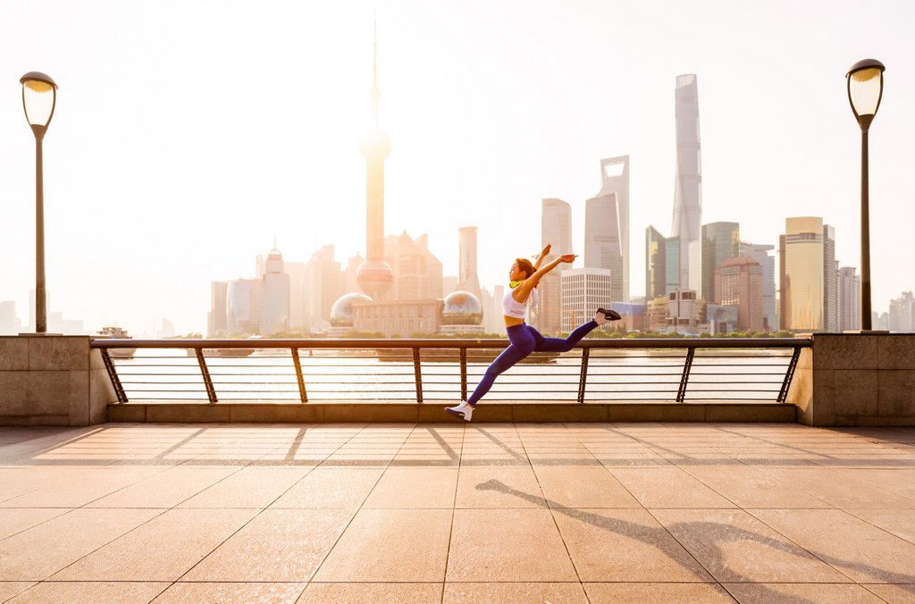 young girl stretching stock photos - OFFSET