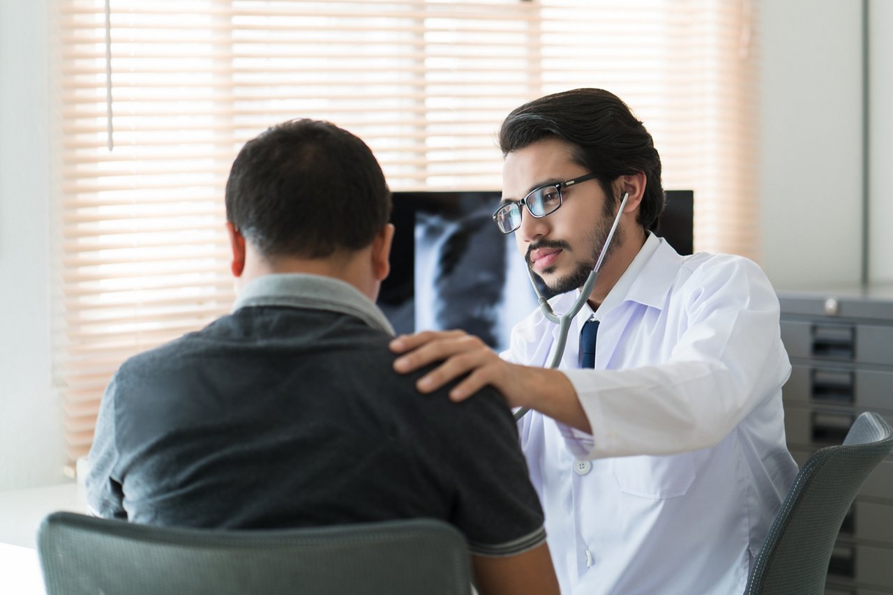 Doctor using a stethoscope during a medical examination