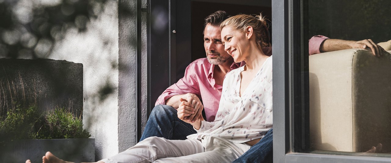 Couple sitting near door