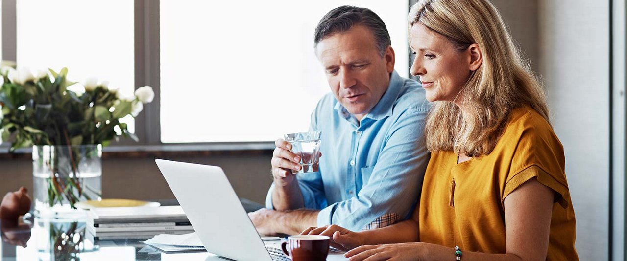 Couple looking at laptop