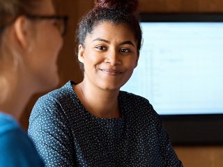 Lady smiling in meeting