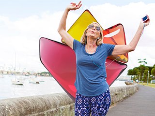 Lady with hands in the air celebrating while exercising