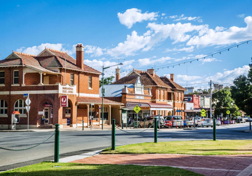 A scenic view showcasing various Australian towns and cities, highlighting their unique architecture and landscapes.