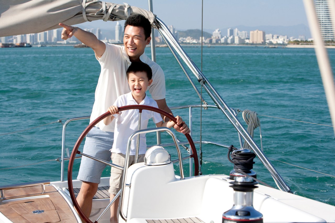 A Father splits time between career achievements and sailing with his son. Carving out time to balance wealth and wellness.