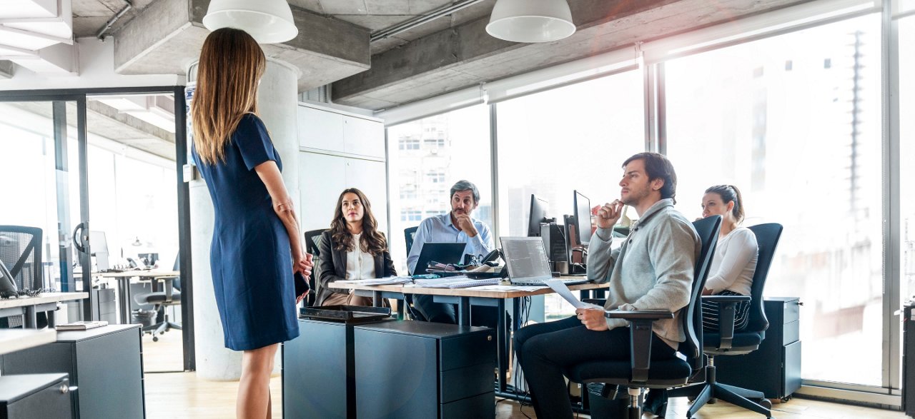 Men and women in boardroom having a meeting