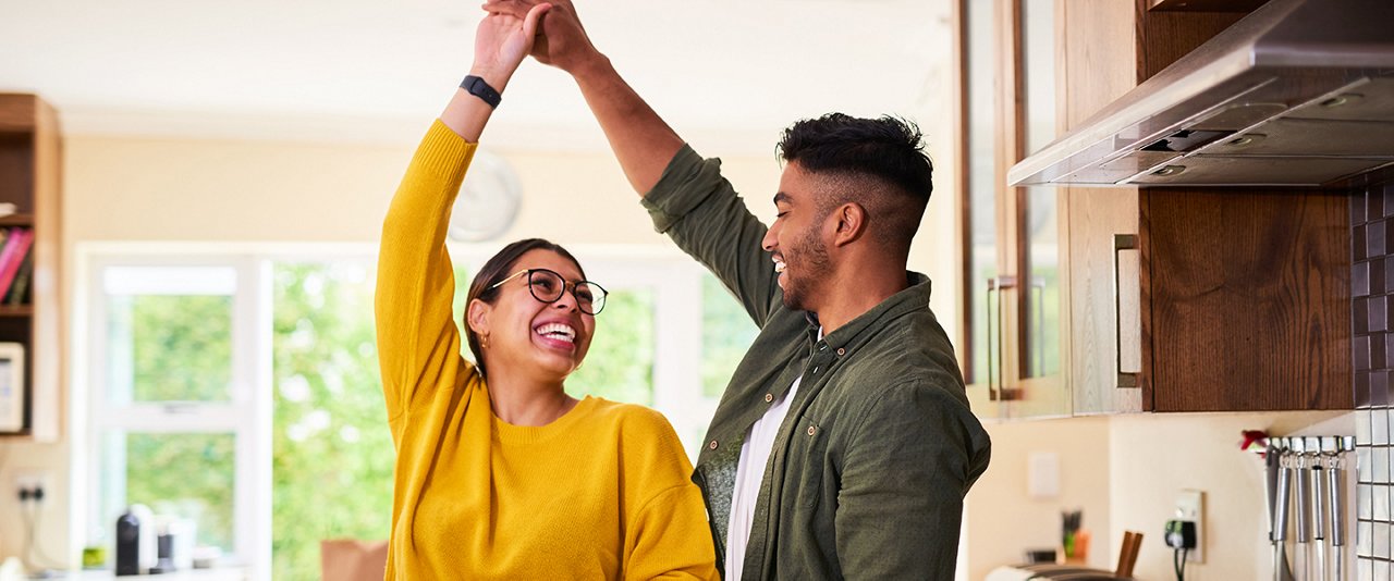 Couple dancing in kitchen