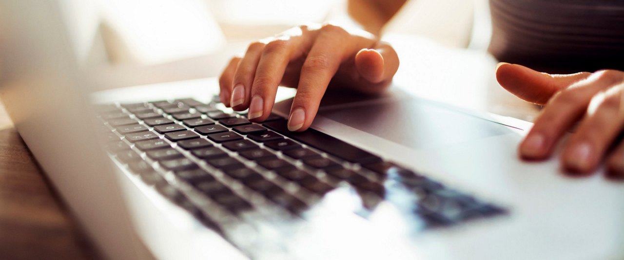 lady typing on laptop