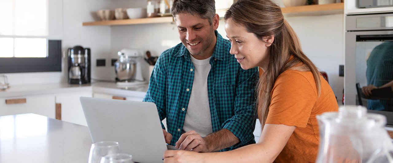 Couple looking at laptop