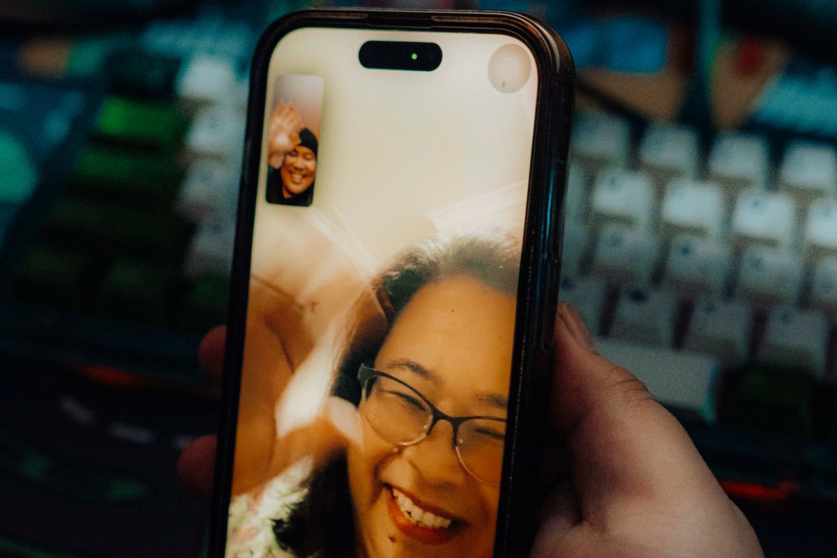 A couple uses their phones to face time each other.