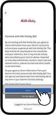 Garmin app privacy policy screen with Agree button highlighted for consent