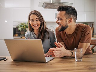 Couple looking at laptop