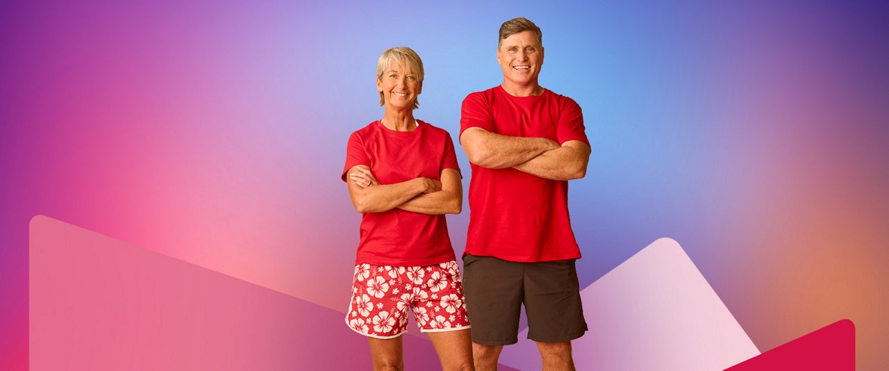 Layne Beachley, Australian former professional surfer, and Shane Crawford, Australian former AFL player, standing with red clothes on.