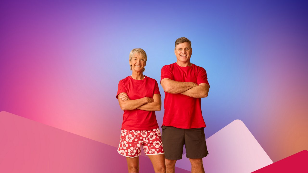 Layne Beachley, Australian former professional surfer, and Shane Crawford, Australian former AFL player, standing with red clothes on.