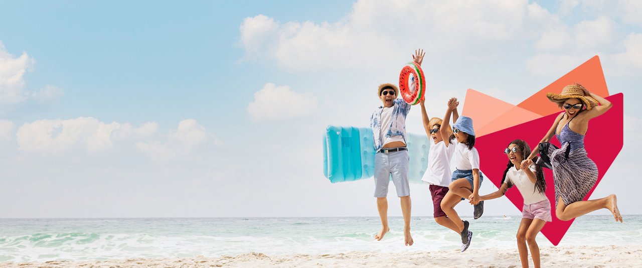 Family jumping at beach