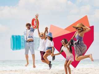 Family on beach jumping