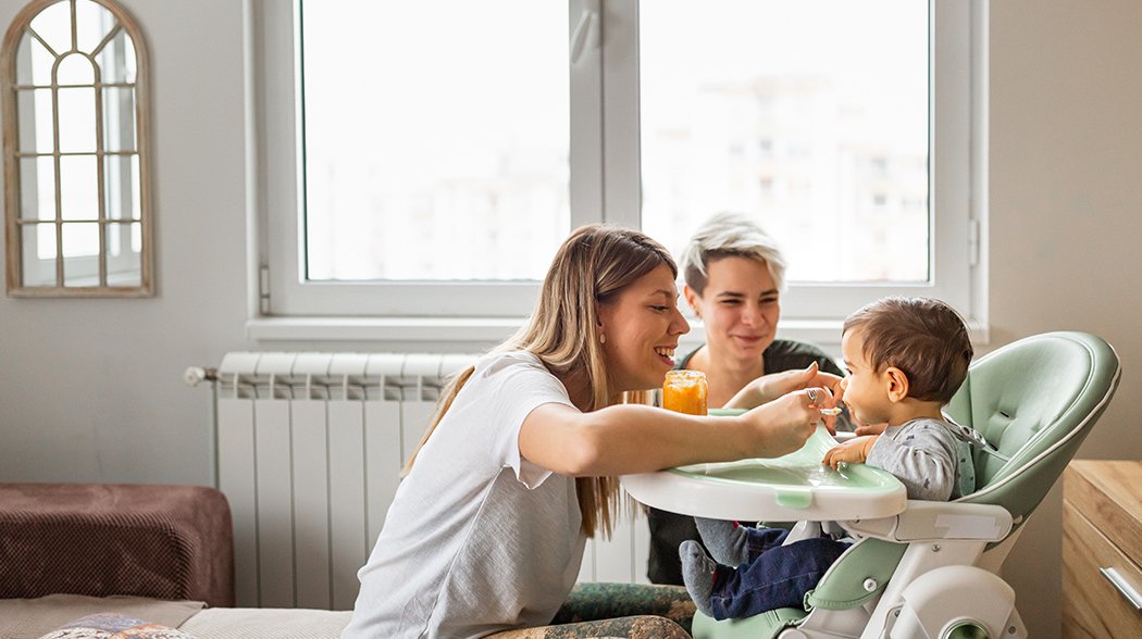 woman feeding baby