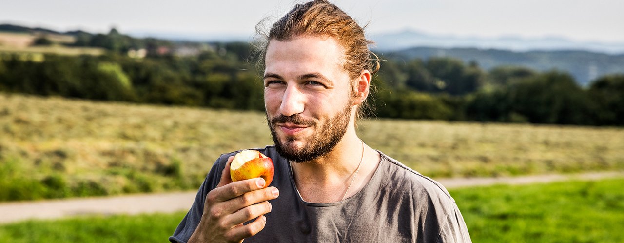 man eating apple