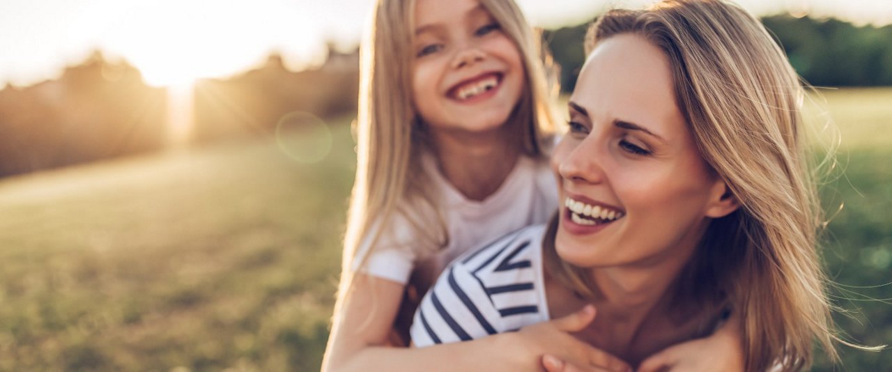 Mother and daughter outdoors