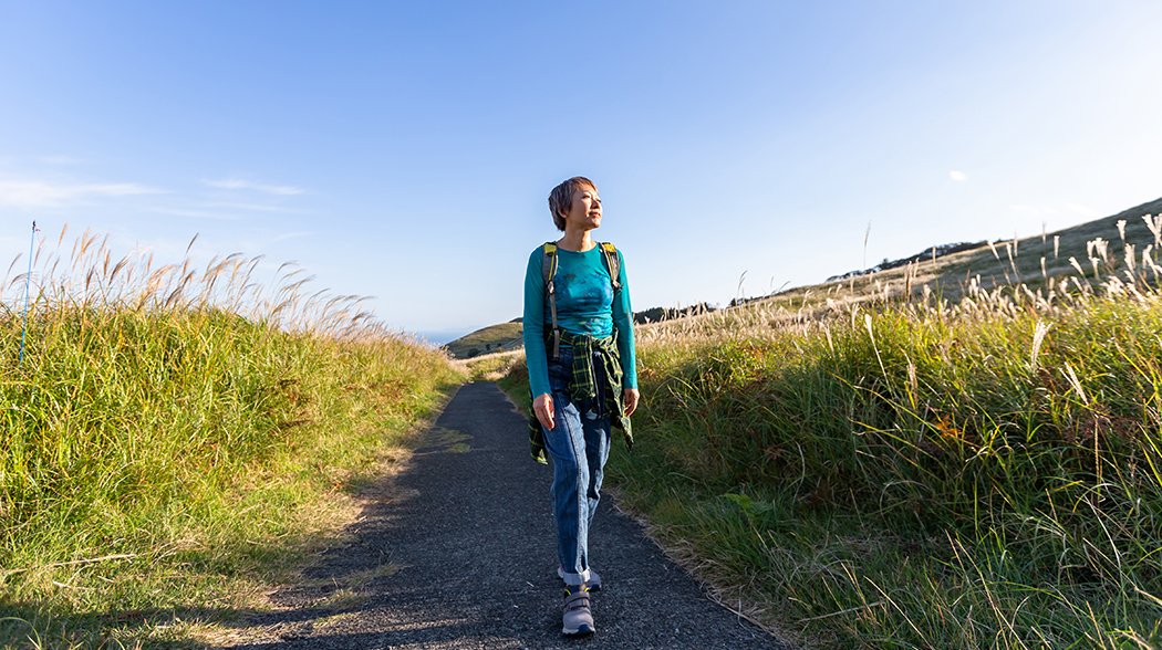 woman walking admiring nature