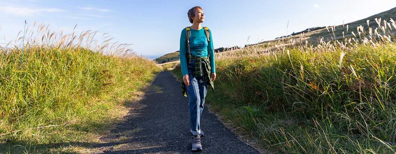 woman walking admiring nature