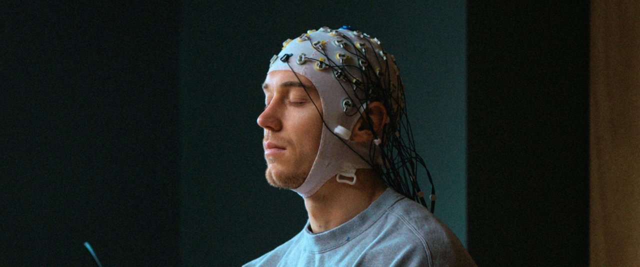 A man with an electronic device on his head.