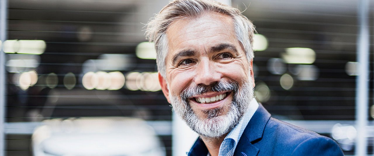 Male in suit smiling