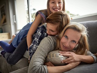 Mother with kids on her back