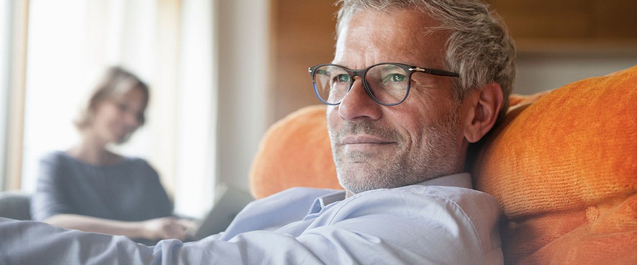 Older male sitting on couch