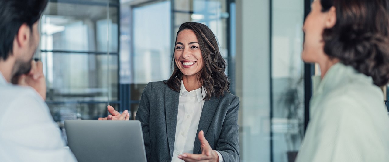 Smiling lady talking to clients