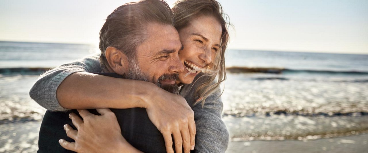 Couple hugging on beach