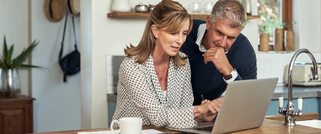 Couple at computer in deep thought