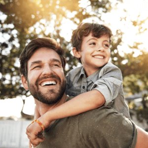 father carrying children