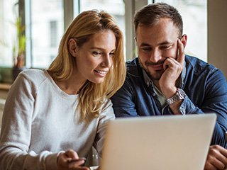 Couple looking at laptop