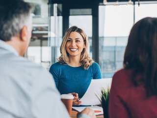 Lady talking to couple