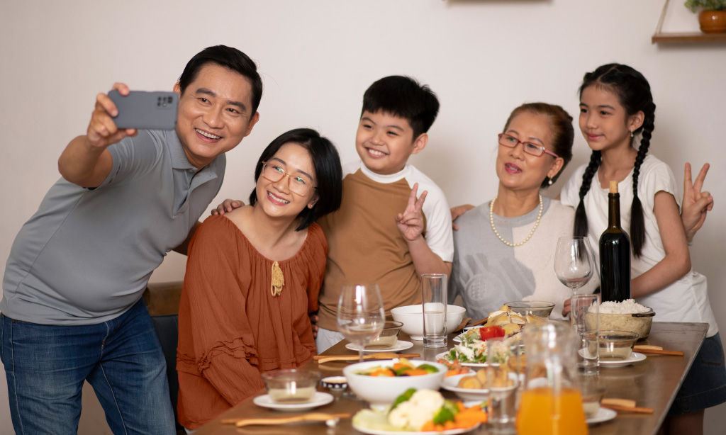 Three females talking and laughing to each other in gym attire.