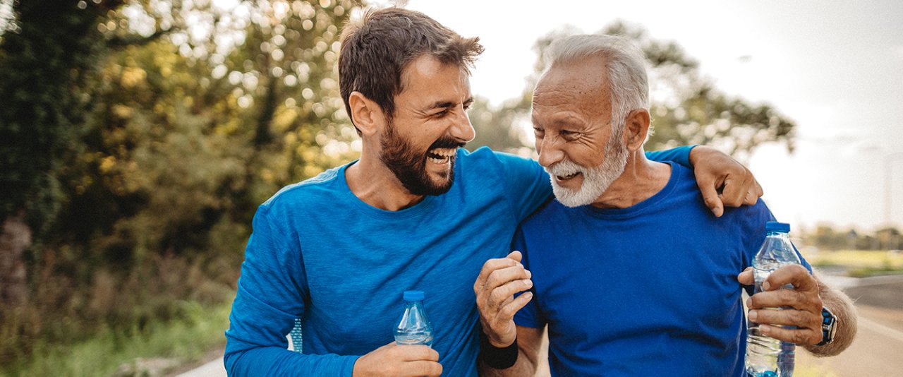 Old man and  young man smiling