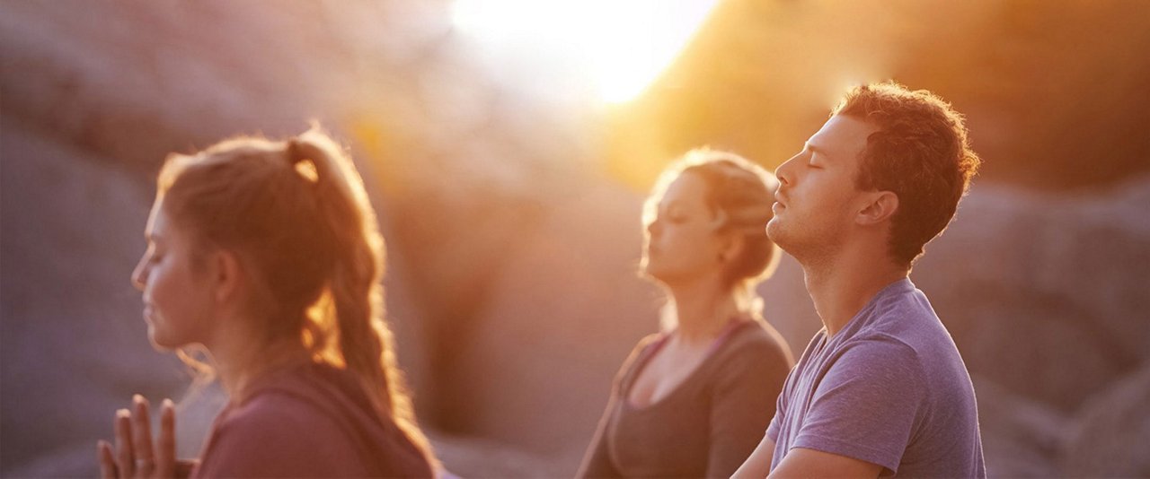 group of people meditating