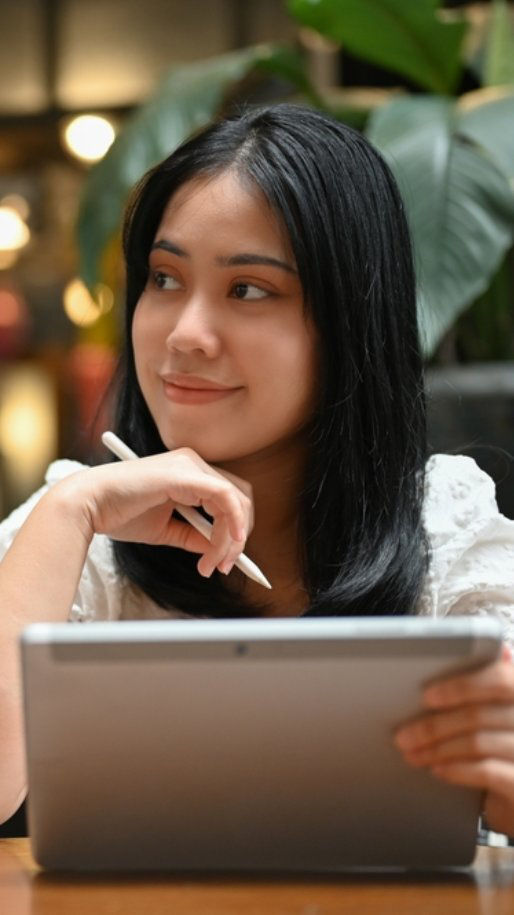 Young Asian woman pauses while taking a quiz on types of insurance. 